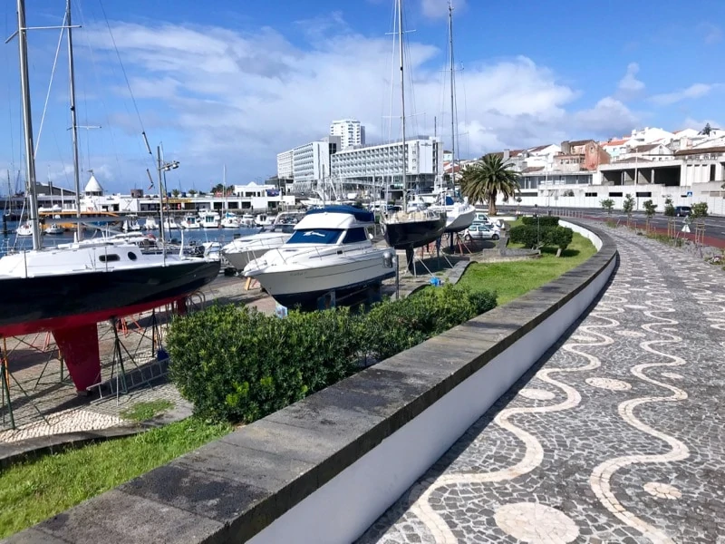 Pretty calçada portuguesa (Portuguese cobblestone pavement mosaics) along Ponta Delgada’s marina promenade