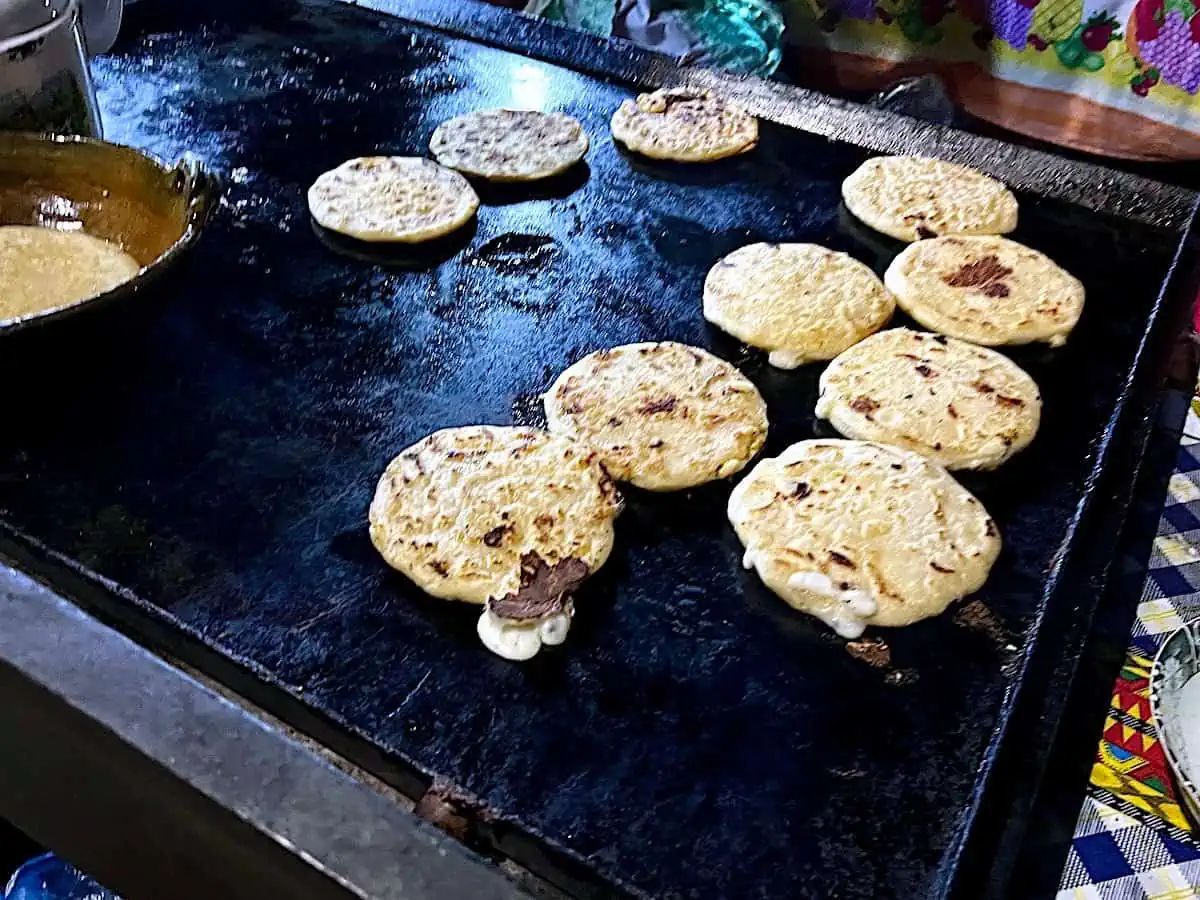 Pupupas on the grill in front of the church in San Pedro Las Huertas. 