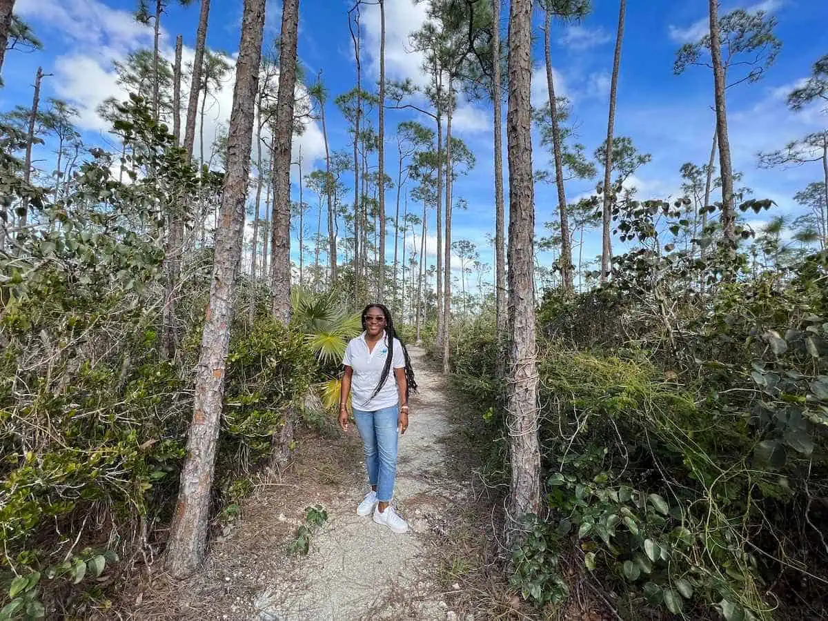 Education Officer on pathway with trees.