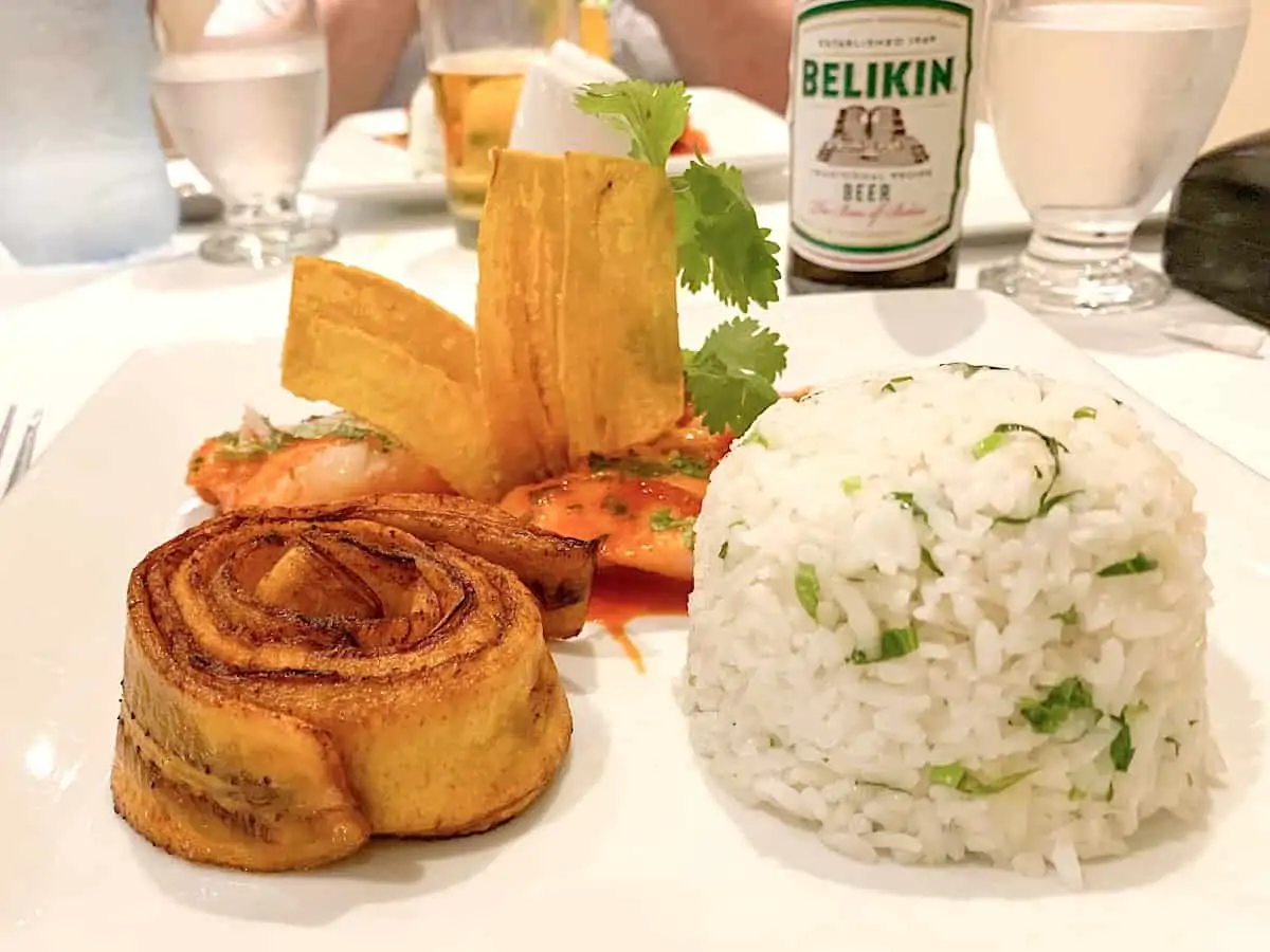 Red snapper with plantain on a white plate.