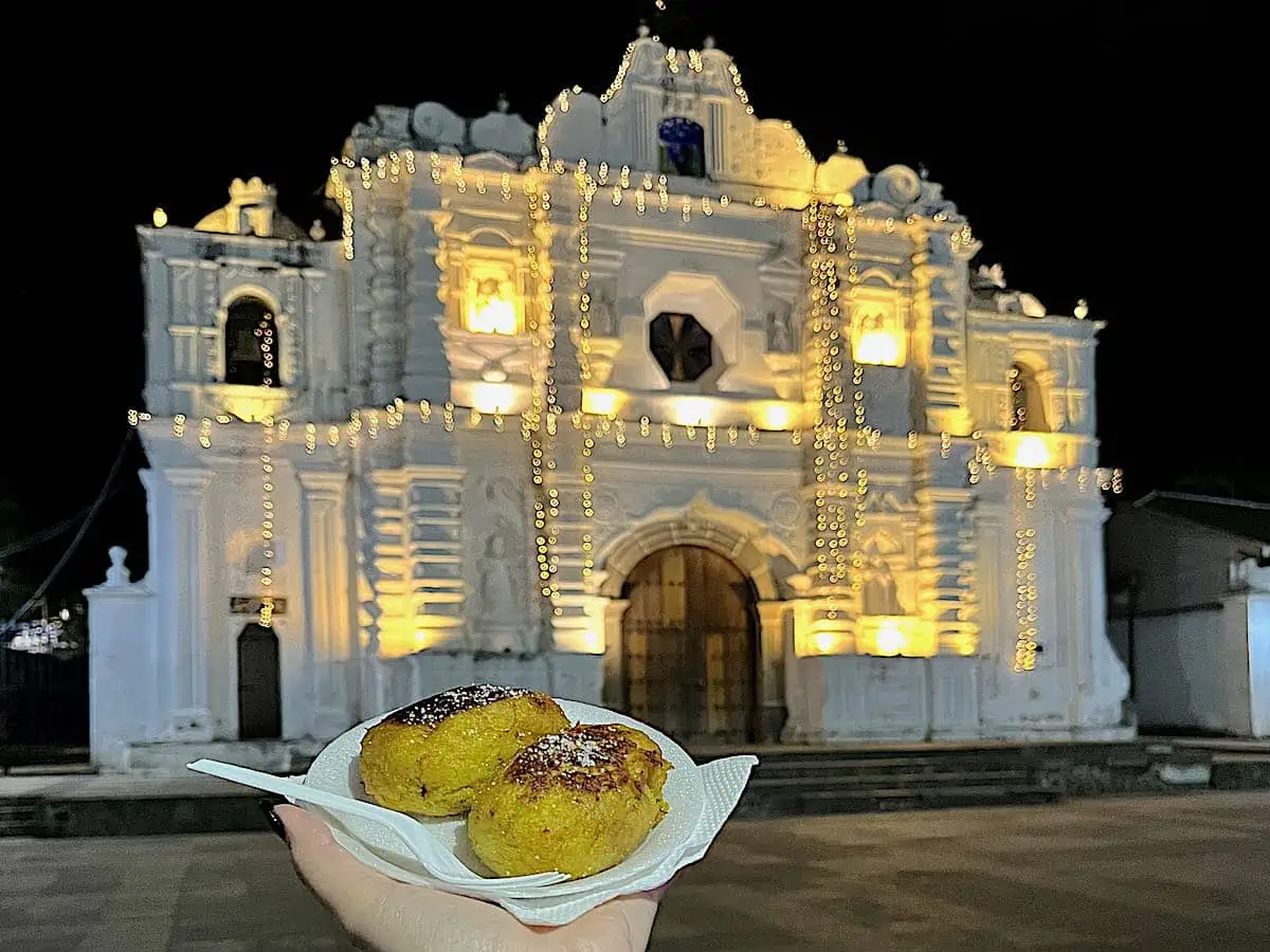 An evening food tour with rellenitos at Santa Ana Church. 