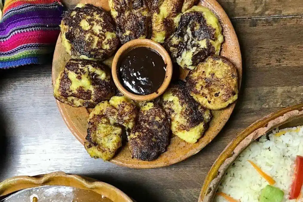 A platter of rellenitos de platano a popular Guatemalan dessert and street food. 