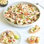 a white bowl of salpicon de mariscos with a singel serving on a slice of baguette.