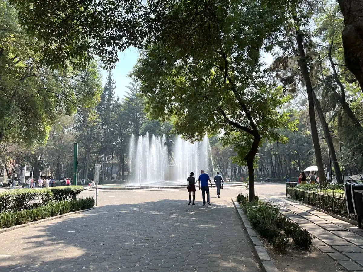 People walking in Plaza Rio de Janeiro in Roma Norte.