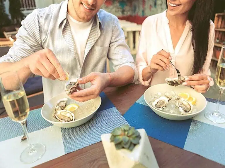 Couple enjoying oysters.