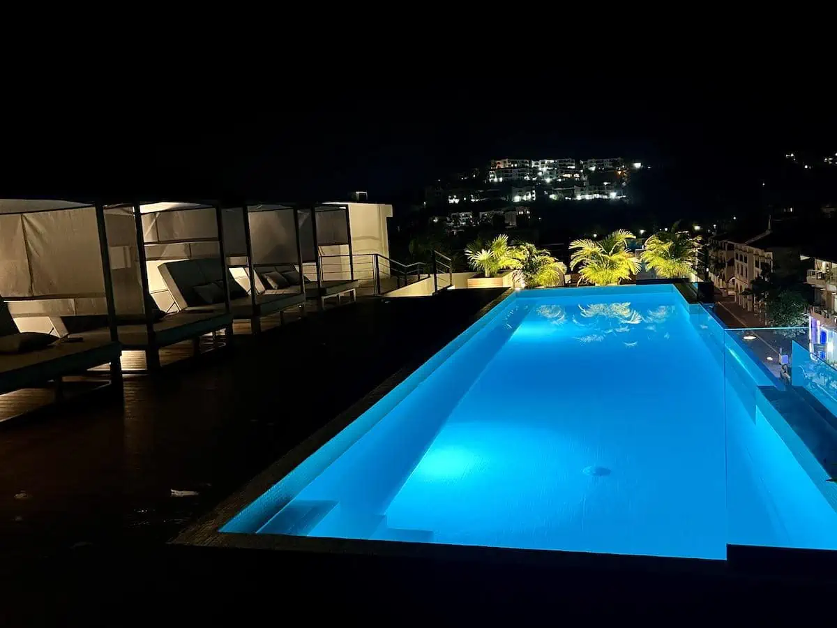 Rooftop pool at Ziba condos in Huatulco at night.