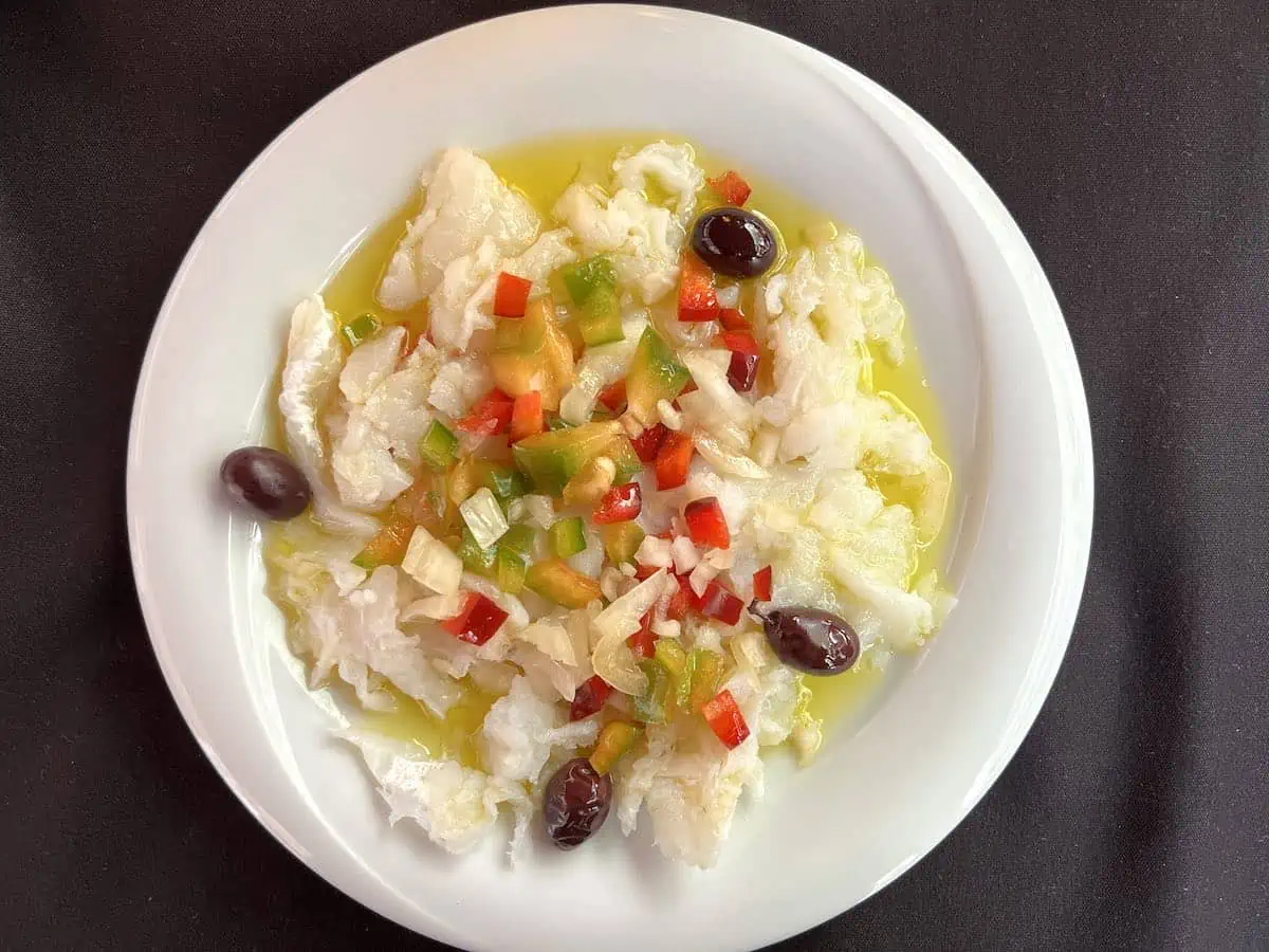 Esqueixada is a delicate yet savoury salad, a Barcelona traditional food  made of salt cod.