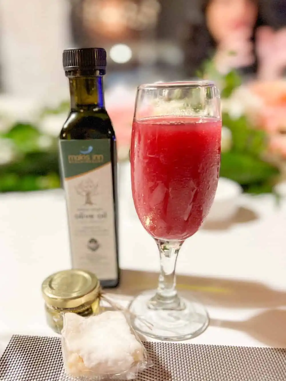 Pomegranate juice in glass on table. 