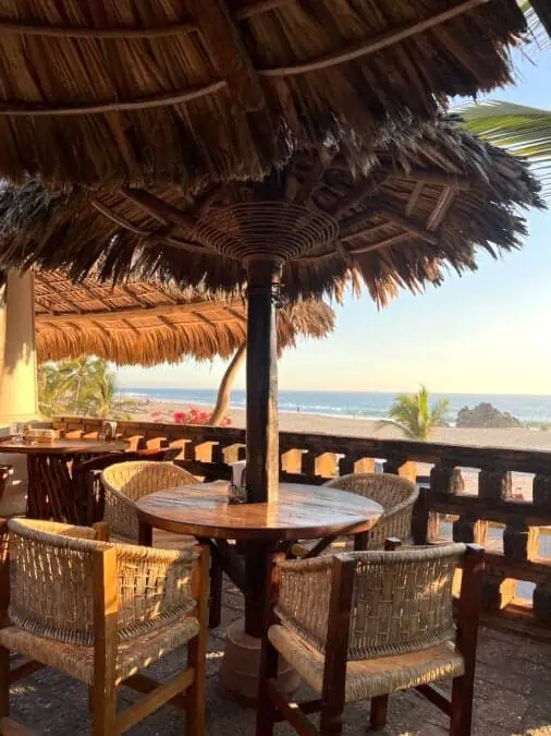 A table with a view of the sunset at Santa Fe Restaurant in Puerto Escondido.  