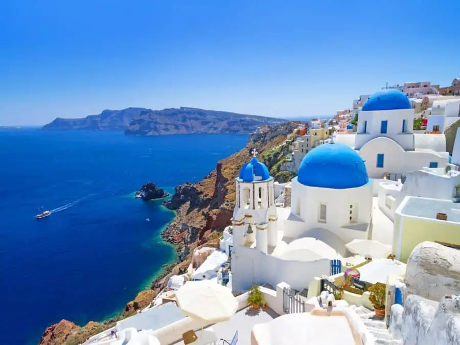 Panoramic view of white buildings in Santorini. 