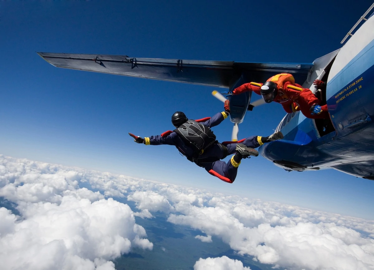 Skydivers jumping from airplane