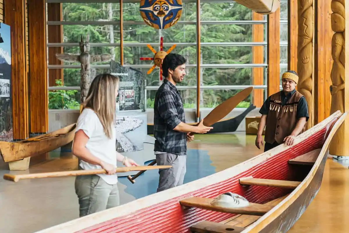 People learning about First Nations culture in Whistler.