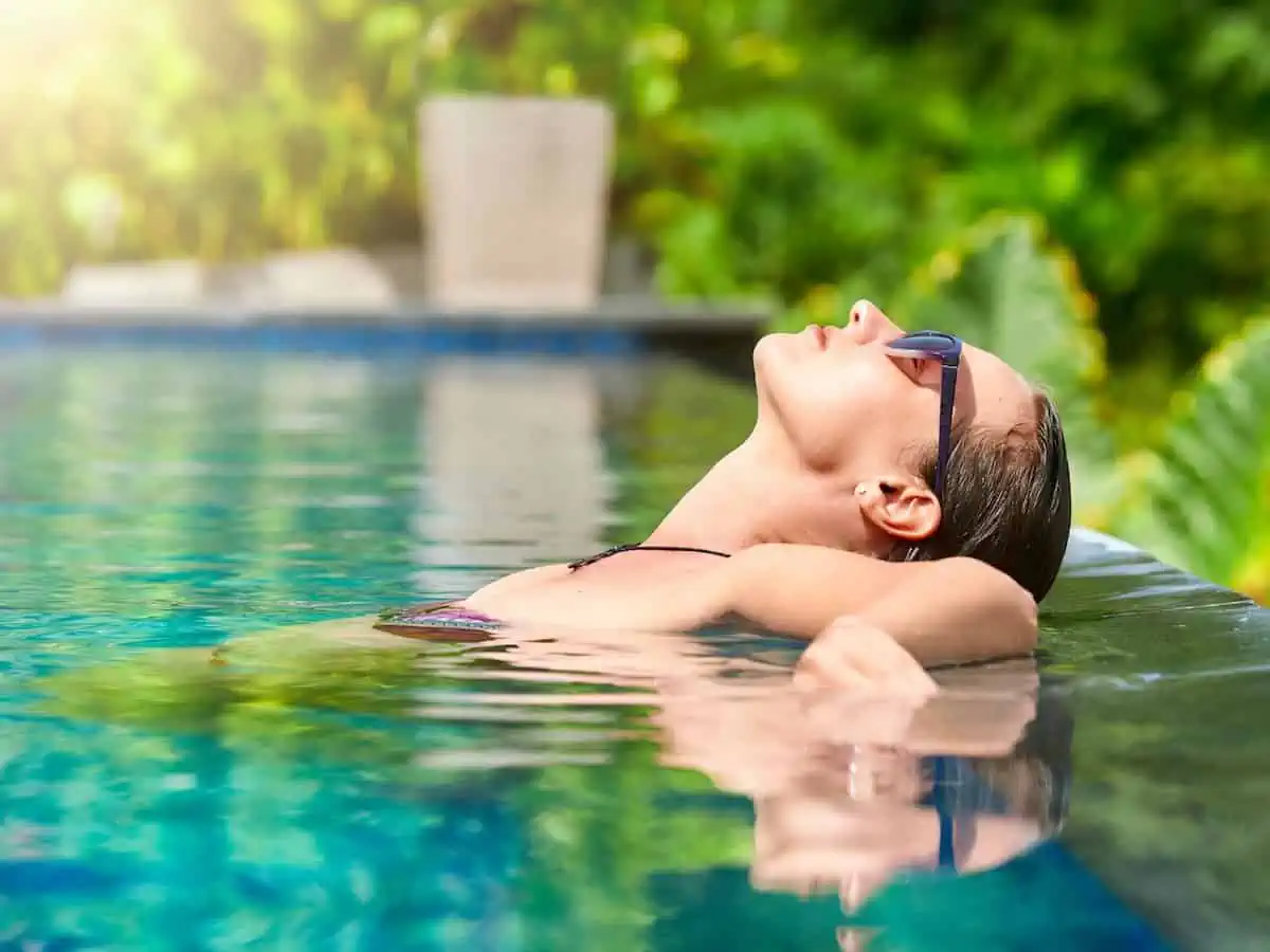 Woman outdoors in a spa pool. 