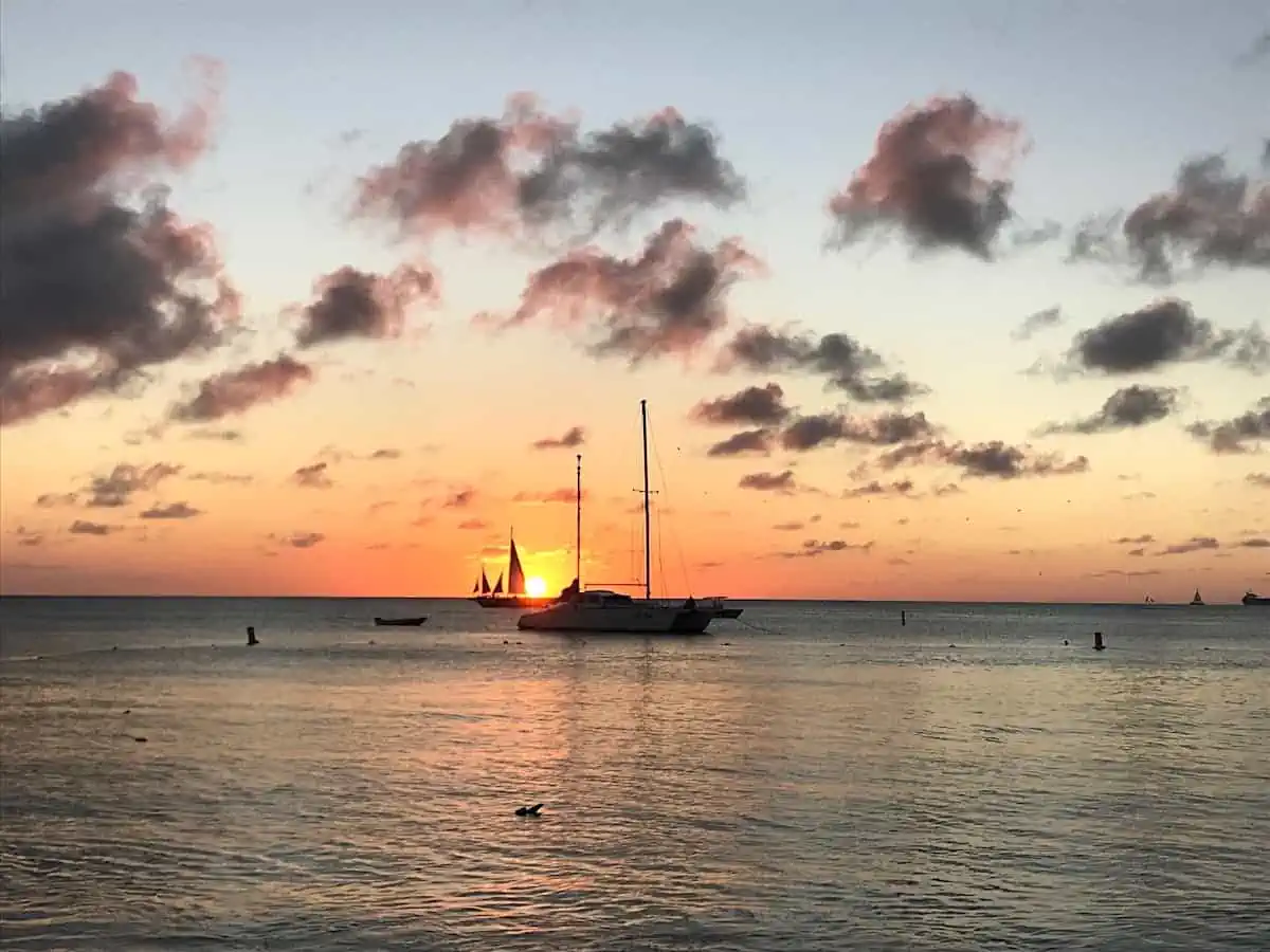 View of sailboats at sunset in Aruba. (Credit: Francisco Sanchez)