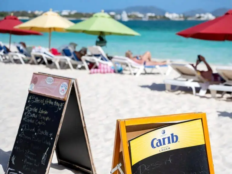 Beach bar signs on beach.