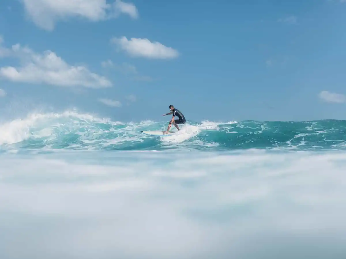 Man surfing on waves in the Pacific. 