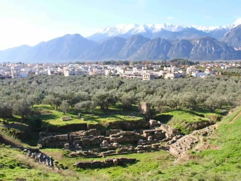 Ruins of ancient Sparta with Taygetus mountains in the distance.