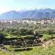 Ruins of ancient Sparta with Taygetus mountains in the distance.