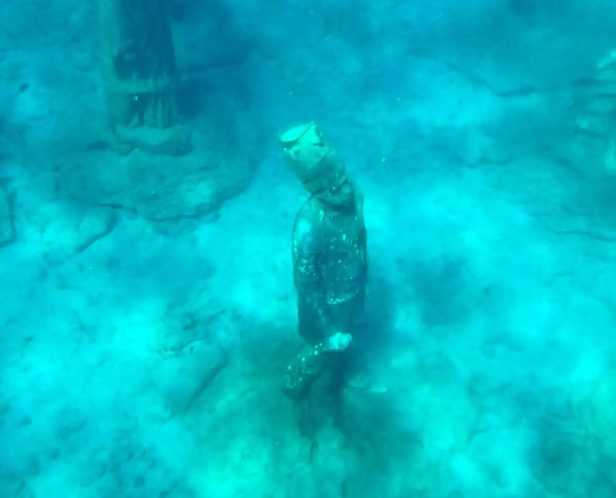 View of the Grenada Underwater Park sculptures from the surface of the water. 