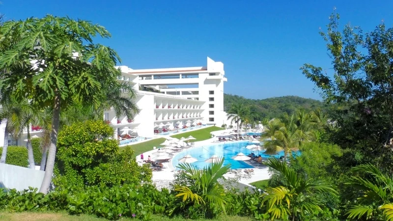 View of swim-out suites in Building 5 from Castaways restaurant at Secrets Huatulco
