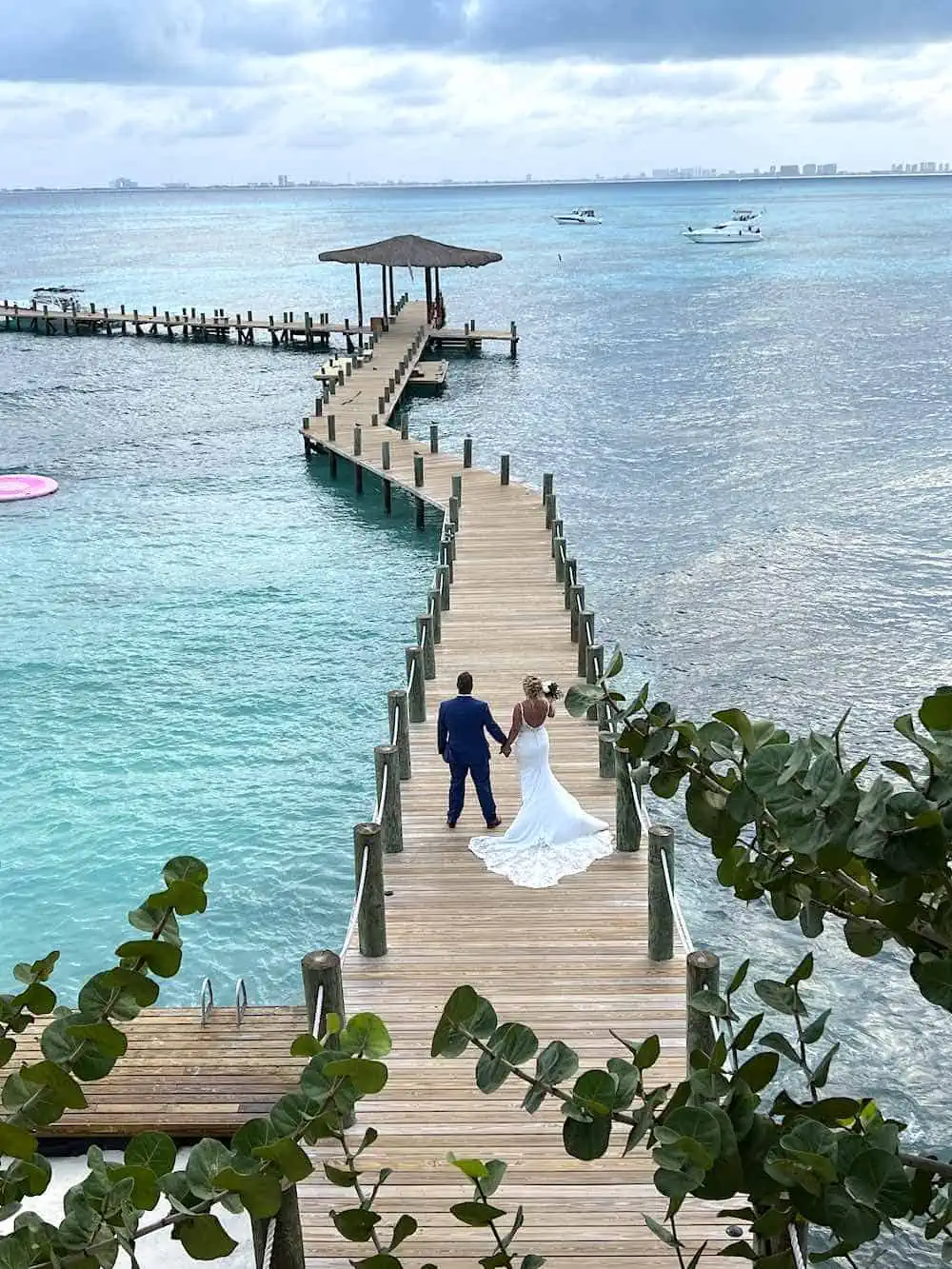 Couple on the wedding pier at Impression Isla Mujeres. 