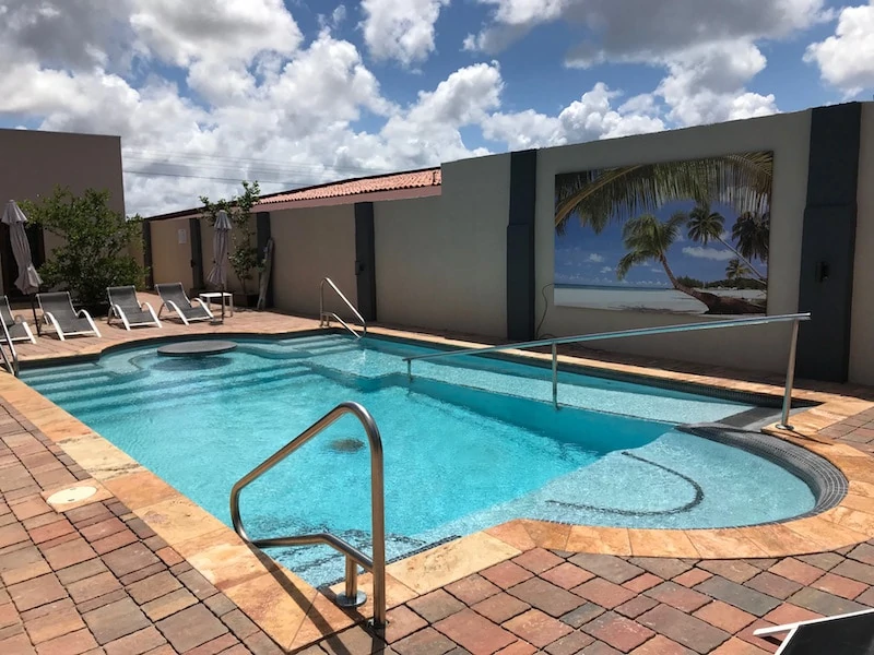 Wheelchair accessible swimming pool at Bubali Luxury Apartments in Aruba.