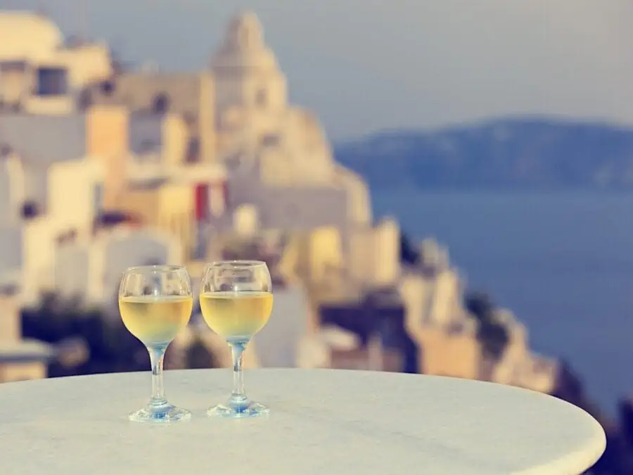 Two glasses of white wine in a wine tour in Santorini Greece.